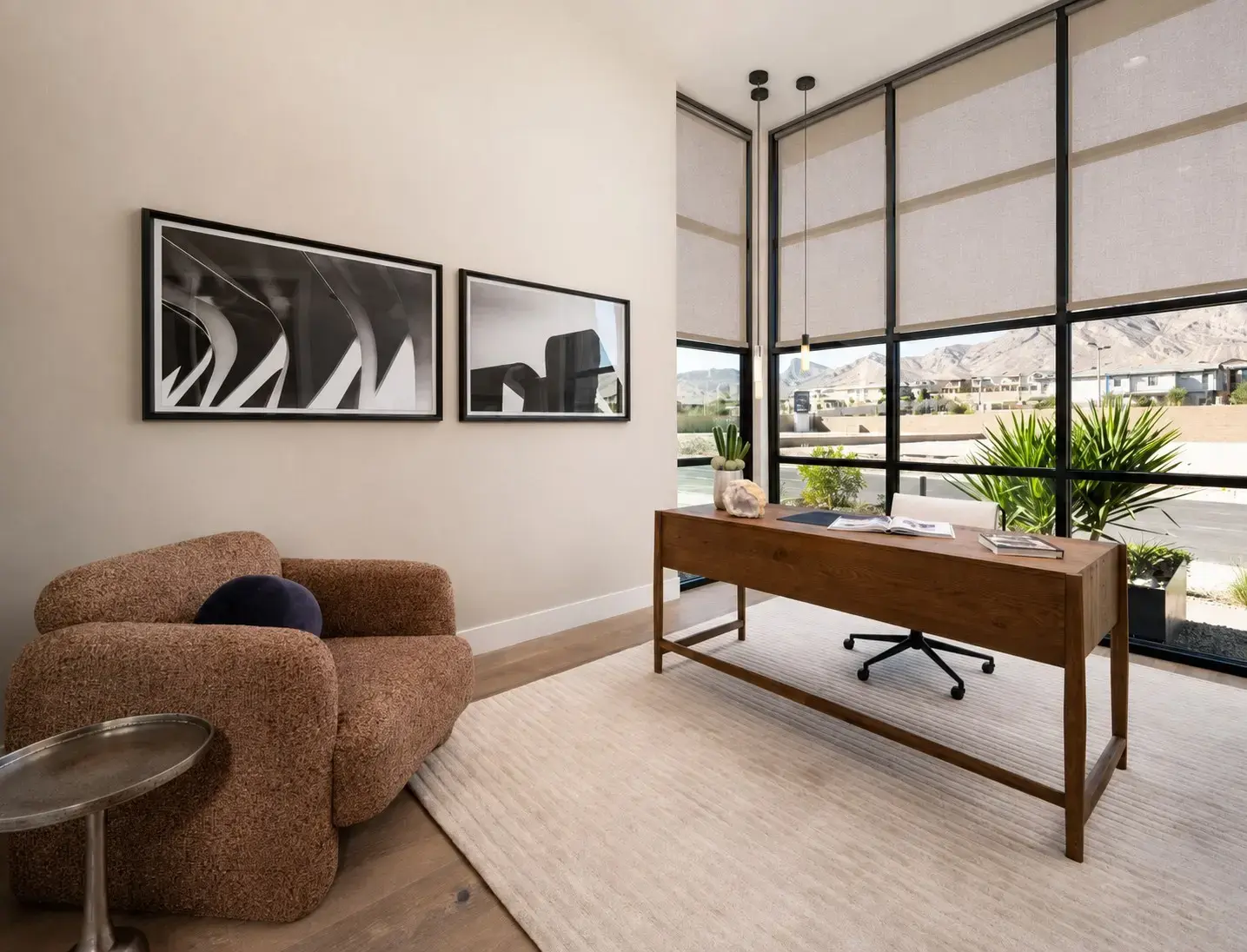 Henderson home office with light greige motorized shades on tall windows