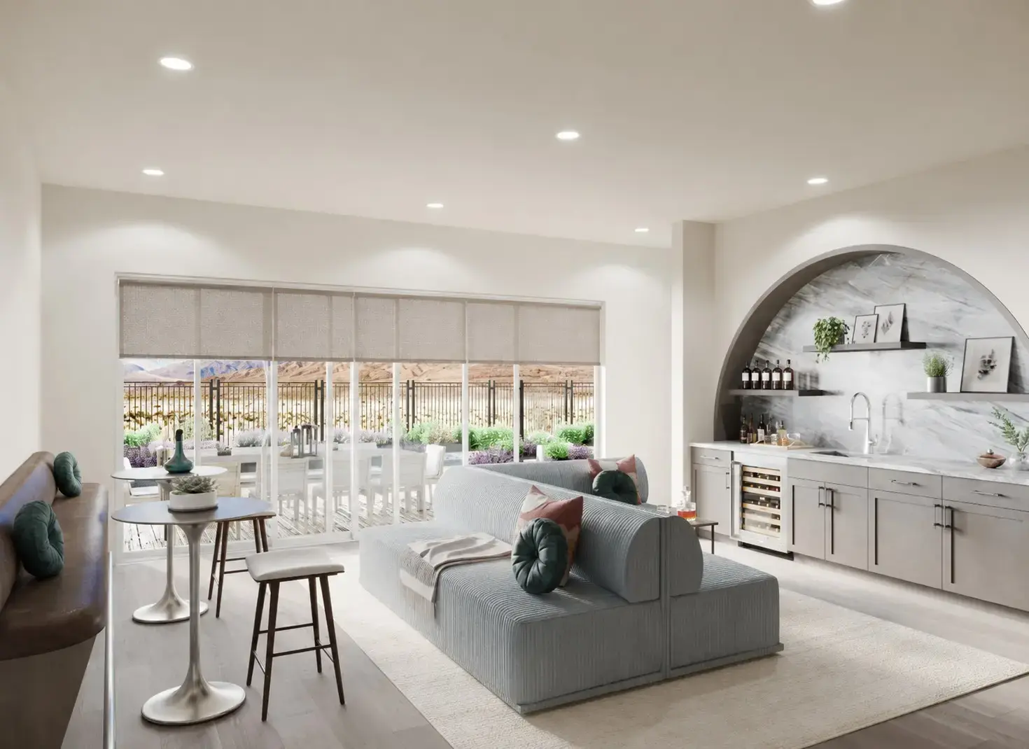 Warm Las Vegas living room with motorized shades planned into the windows