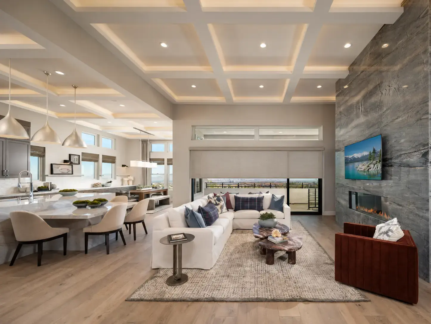 Modern Las Vegas great room with motorized shades across a large wall of glass